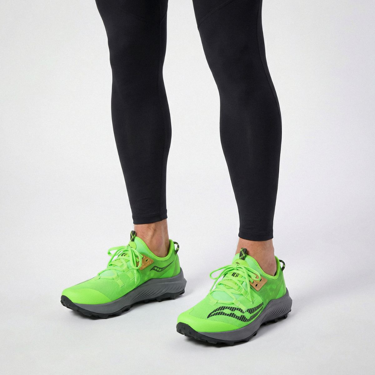 A pair of Saucony Endorphin Rift running shoes with green replacement shoe laces by Kicks Shoelaces.