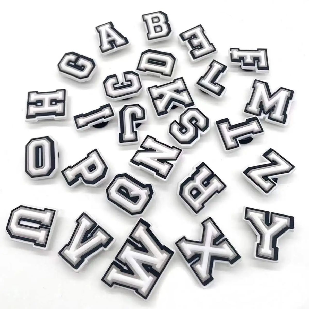 Full A–Z range of varsity letter shoe charms compatible with Crocs shoes, showing the complete alphabet for custom personalization
