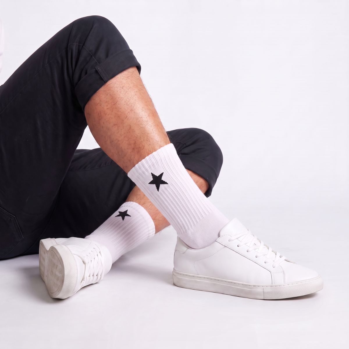 Model wearing White Crew Socks with white sneakers, highlighting moisture-wicking athletic socks with breathable comfort and cushioned support.